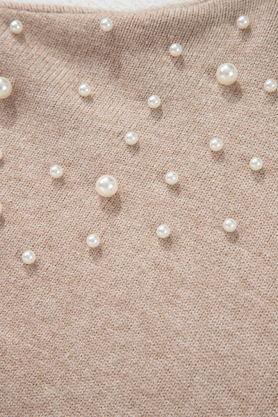 Dust Storm knit sweater with scattered pearl embellishments and balloon sleeves.