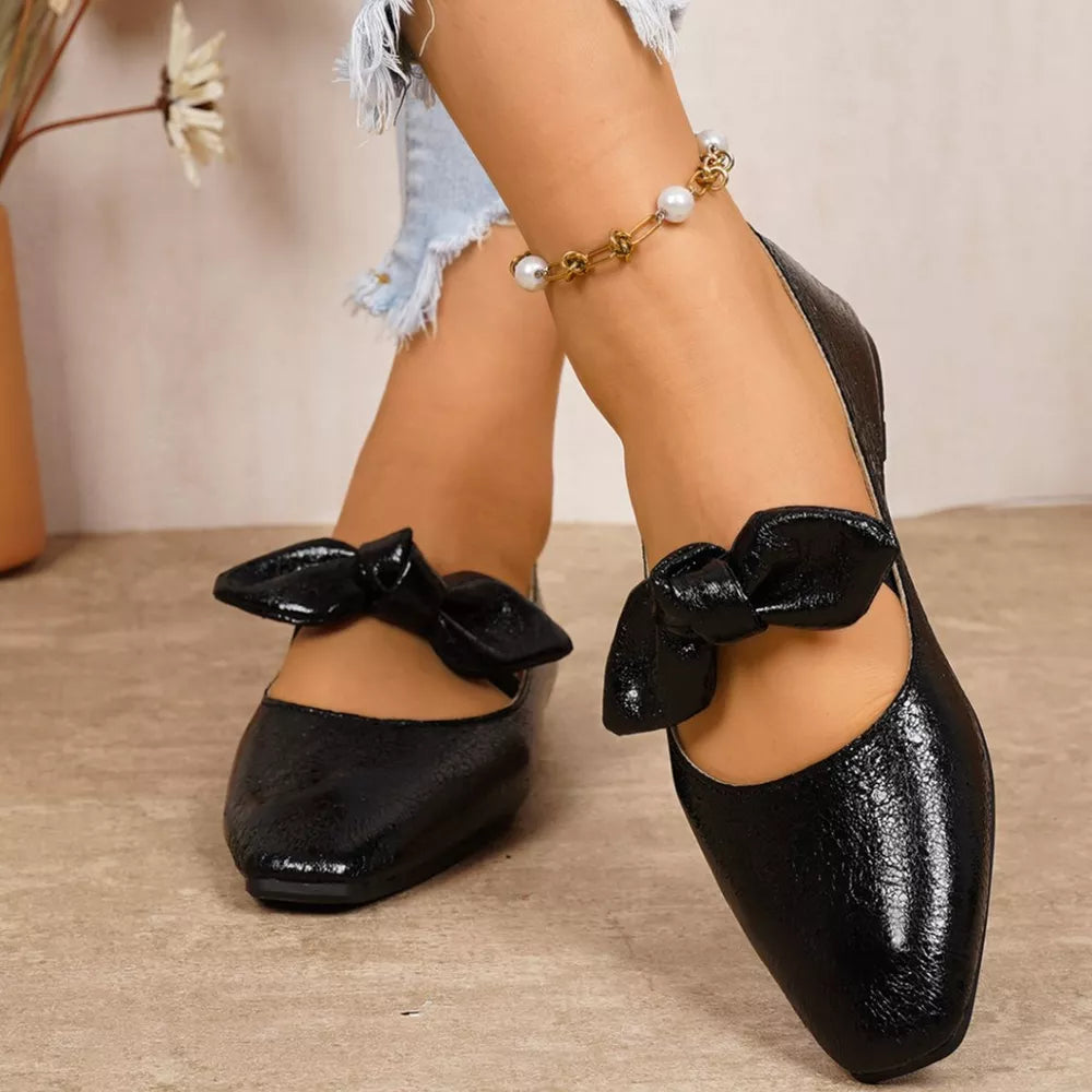 Black square toe slip-on flats with bow detail and pearl anklet