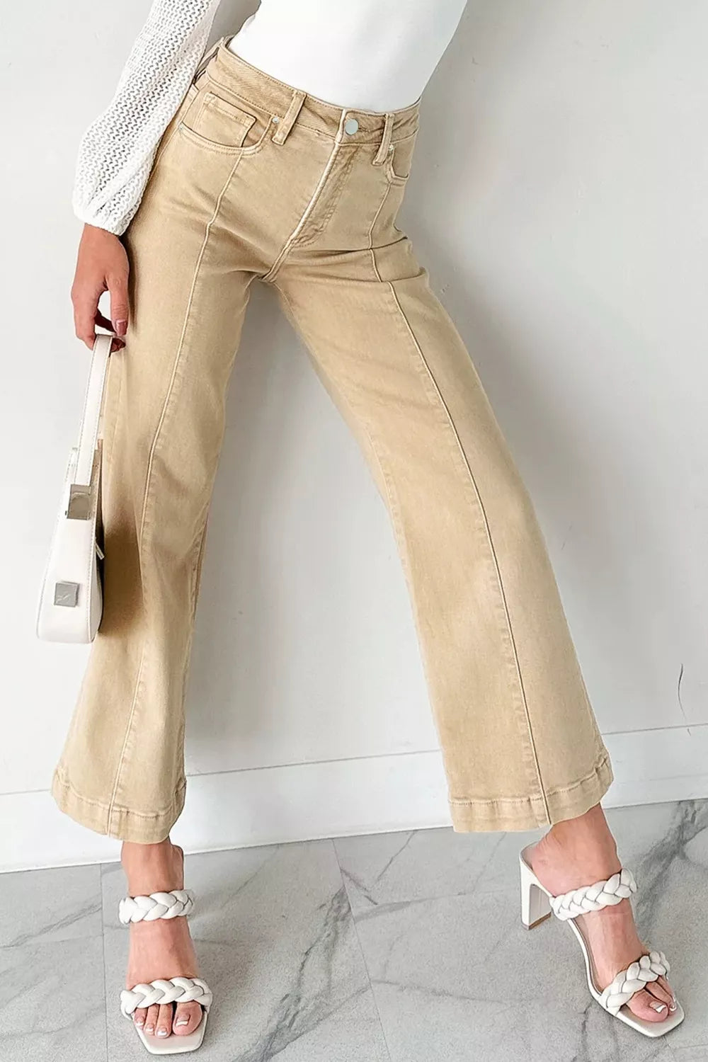 High-waisted cropped wide-leg jeans in tan denim with front seam detail.