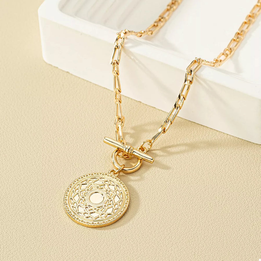 Silver necklace featuring chain link and geometric
