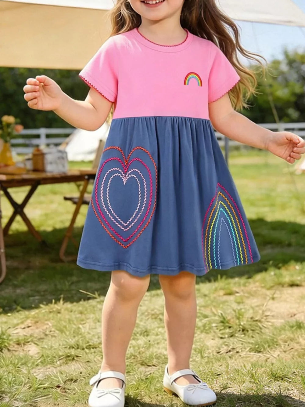 Toddler dress with pink top, blue skirt, heart and rainbow embroidery, short sleeves.