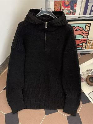Black ribbed knit hoodie with quarter zip and long sleeves