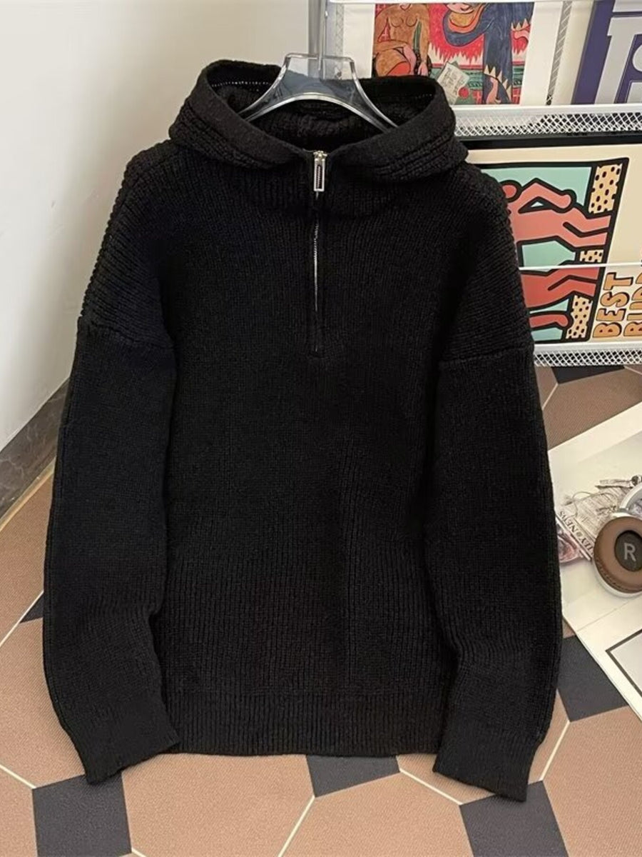 Black ribbed knit hoodie with quarter zip and long sleeves
