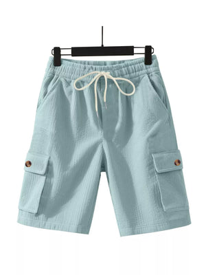 Light blue textured drawstring cargo shorts with button flap pockets.