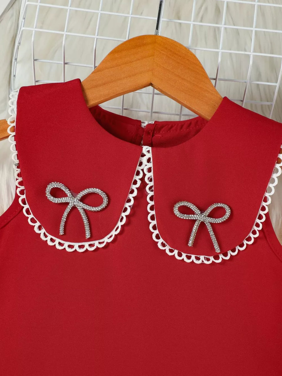 Red toddler dress with lace-trimmed collar and jeweled bows.