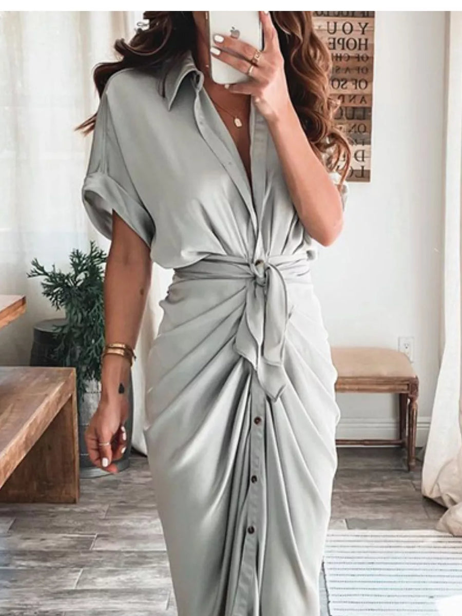 Light gray tie-waist midi dress with short sleeves, collared neckline, and button front detail.