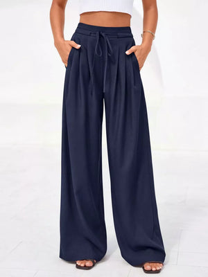 Dark blue high-waisted pleated pants with drawstring and pockets