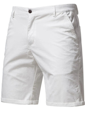 White chino shorts with elastic waist and button closure.