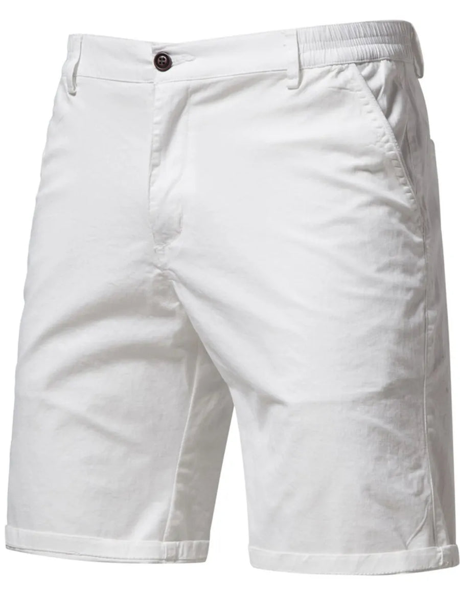 White chino shorts with elastic waist and button closure.