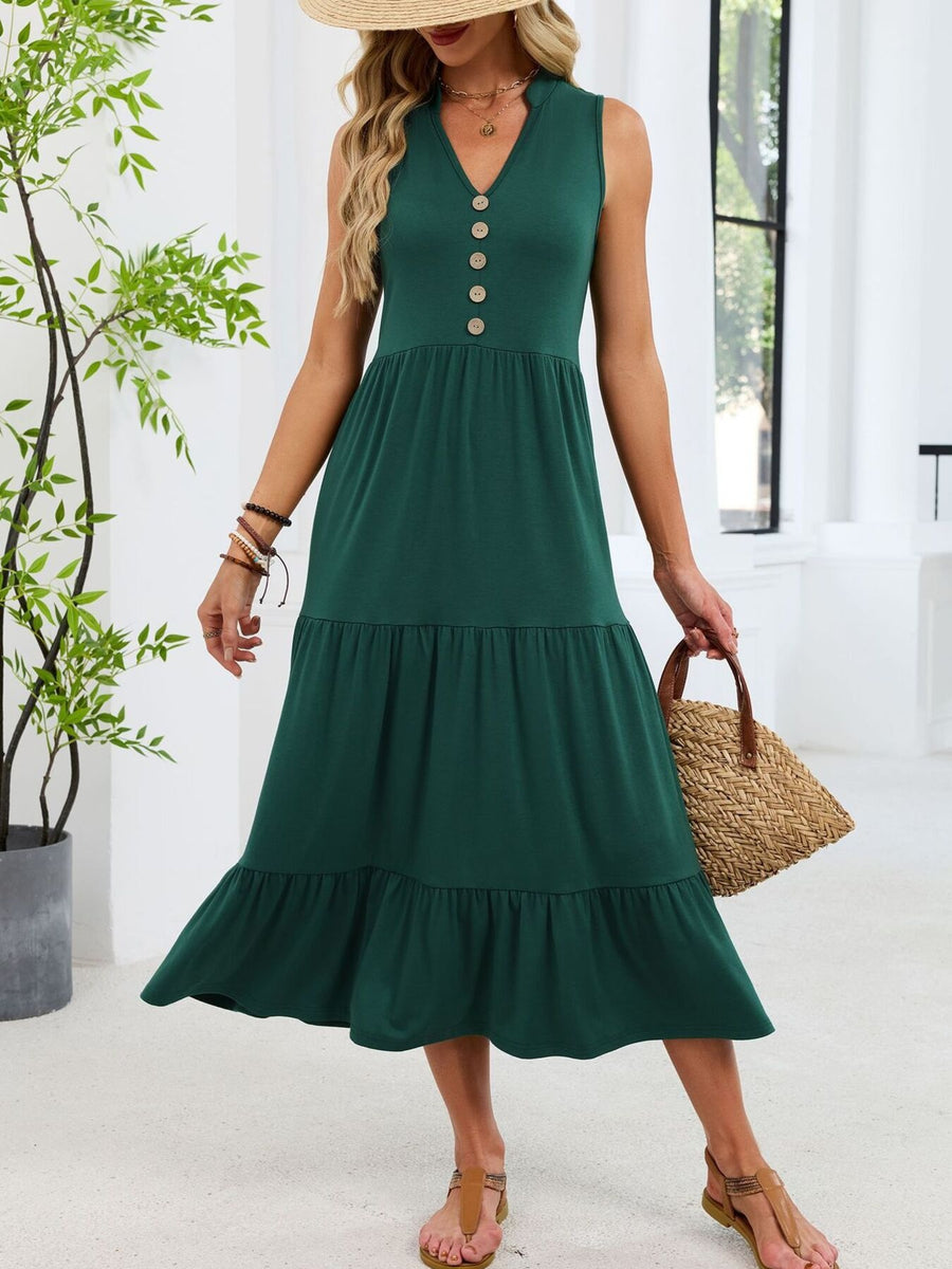 Dark green tiered midi dress with notched V-neck and decorative buttons.