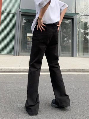 Men's black high-waisted flare leg trousers with a casual streetwear style.