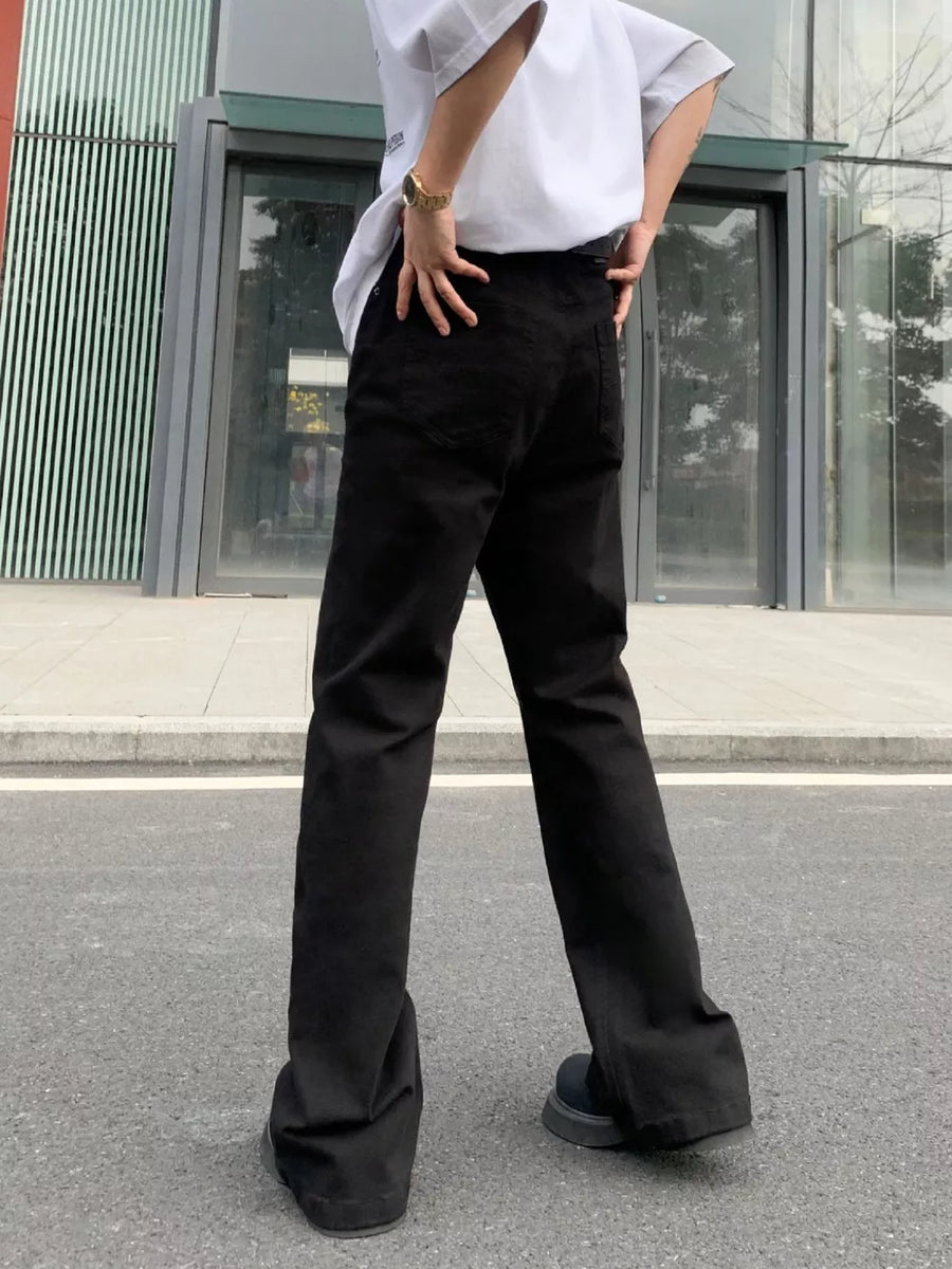 Men's black high-waisted flare leg trousers with a casual streetwear style.