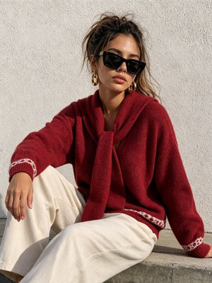 Gray pullover sweater featuring dropped shoulder and geometric