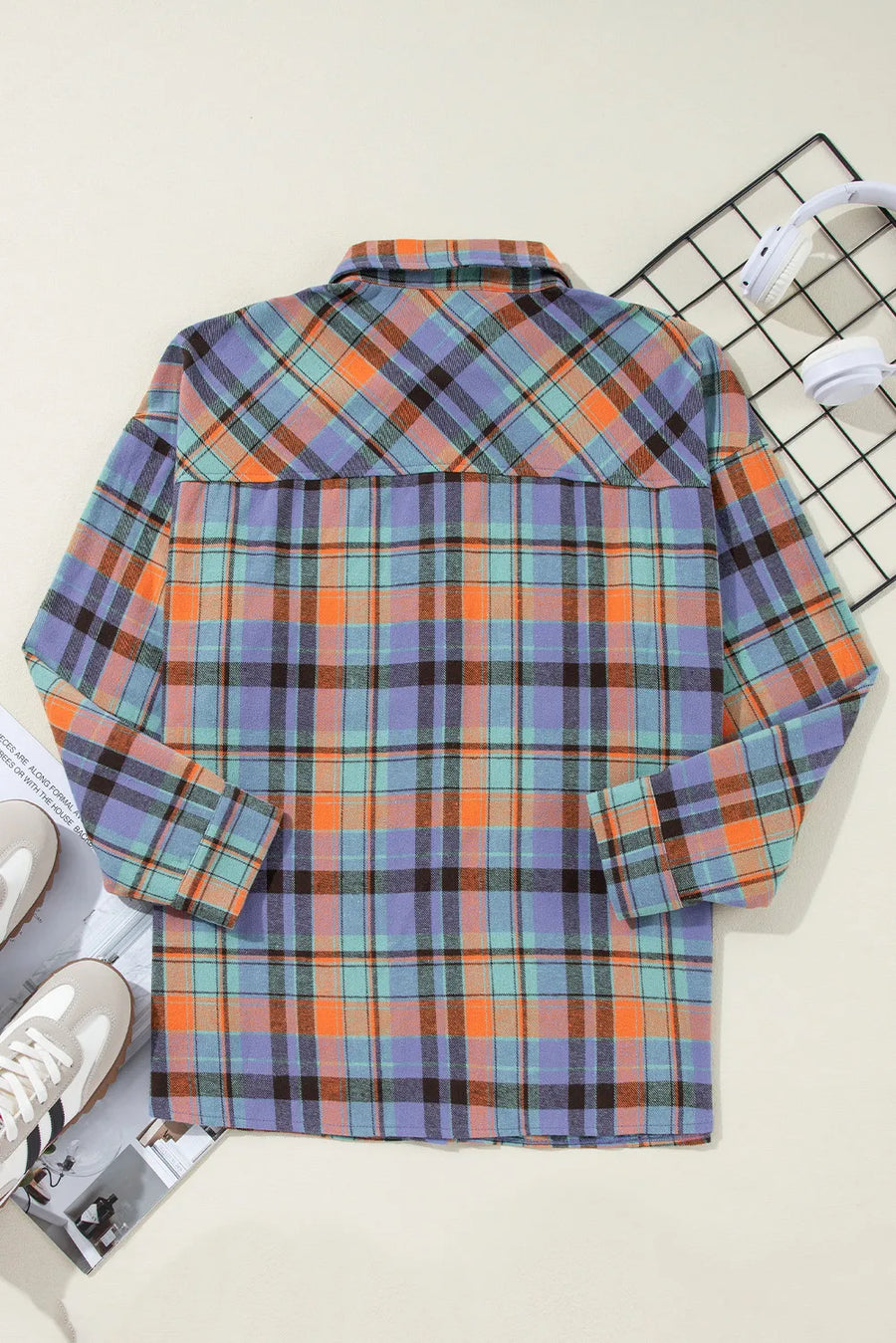 Oversized plaid shacket with button-down collar in orange and purple check.
