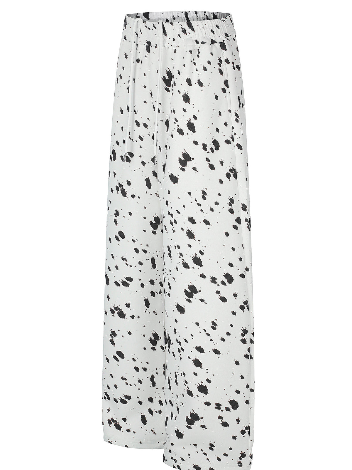black wide-leg pants featuring elastic waist and paint splatter
