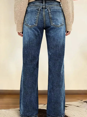 Dark blue denim straight leg jeans with vintage wash and buttoned closure.