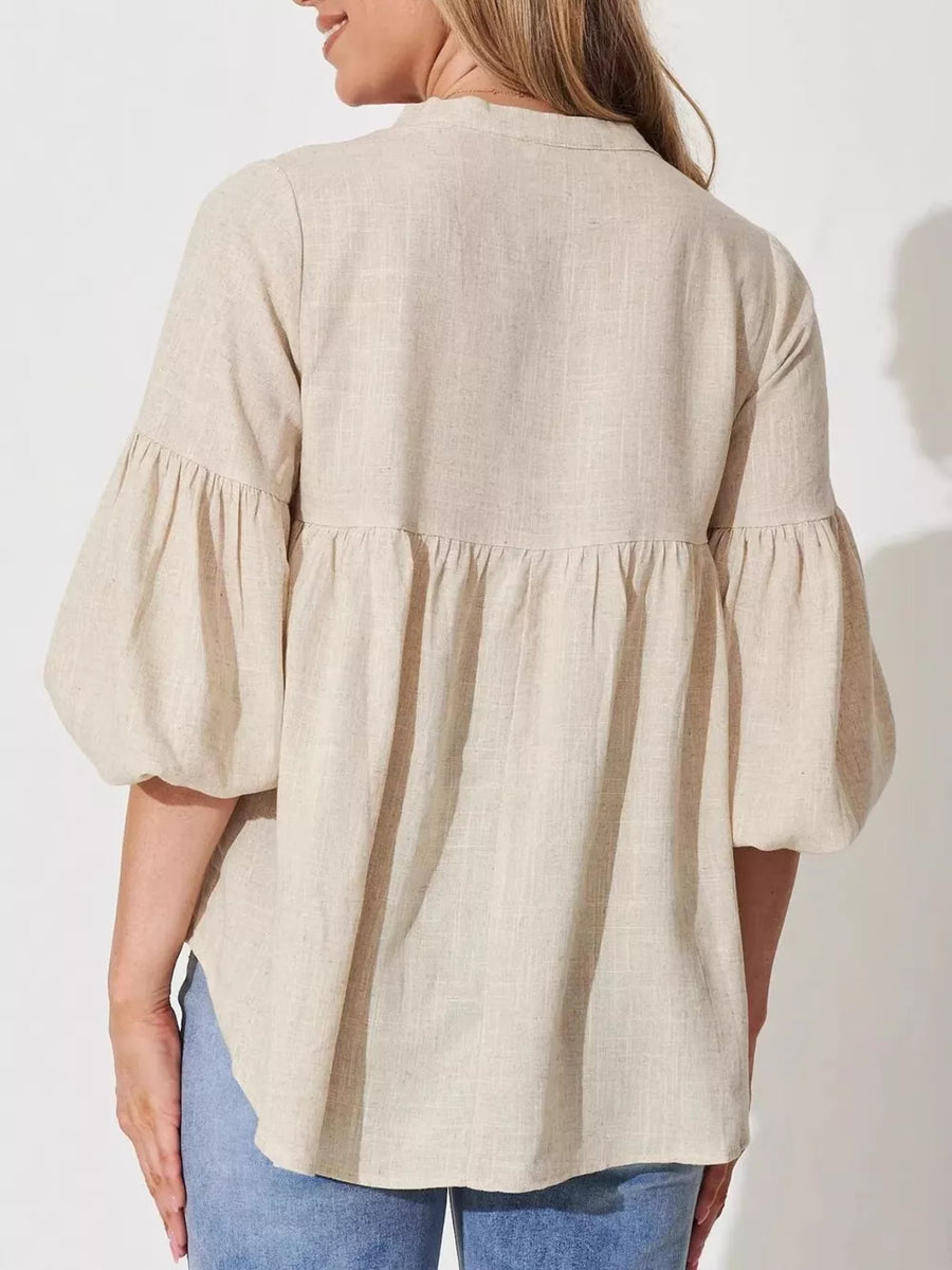 Maternity shirt in beige linen-blend with balloon sleeves and gathered details.