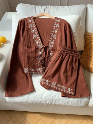 Brown embroidered tie-front top and shorts set with white paisley detail.