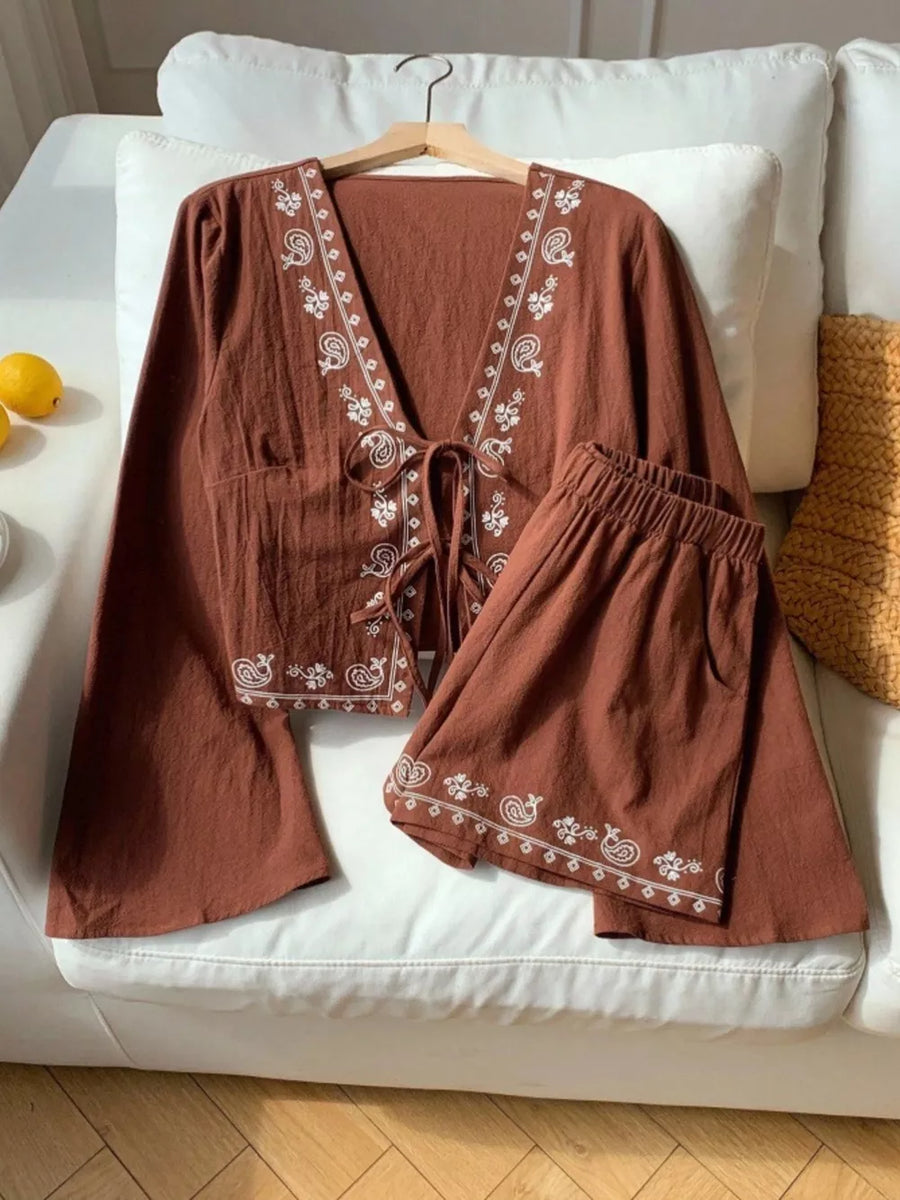 Brown embroidered tie-front top and shorts set with white paisley detail.