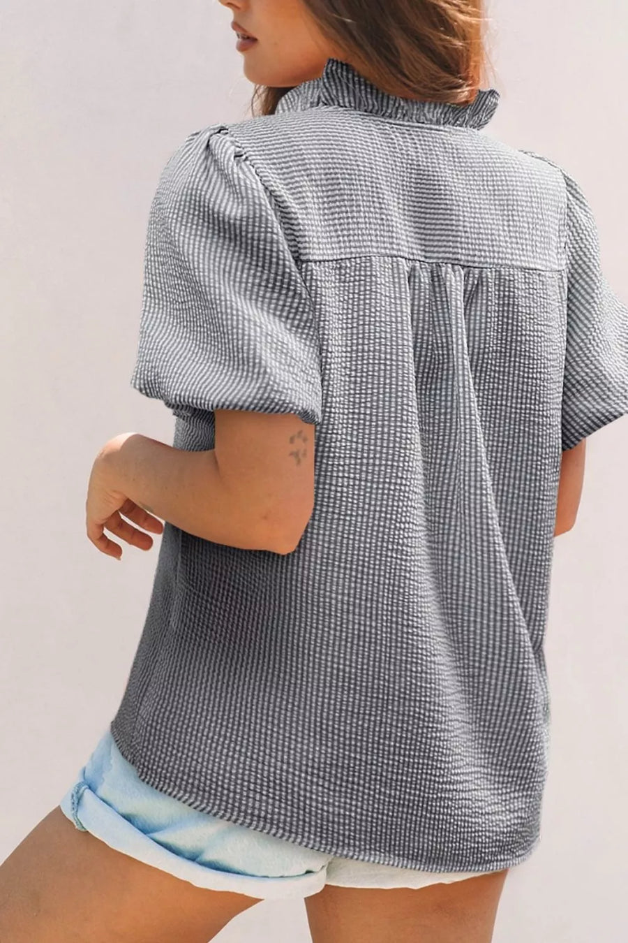 Maternity striped ruffle detail shirt with puff sleeves and textured fabric.