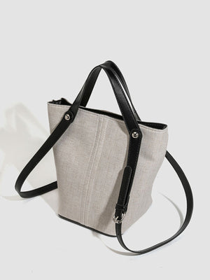 handbag in black with adjustable strap and small
