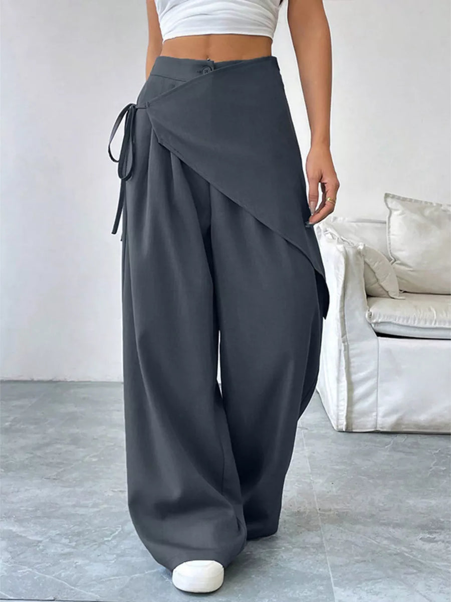 Dark gray wide-leg pants with wrap-style overlay and tie detail