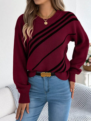 Red striped casual round-neck sweater with black diagonal stripes, acrylic blend.