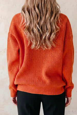 orange pullover sweater with ribbed cuffs and long sleeve
