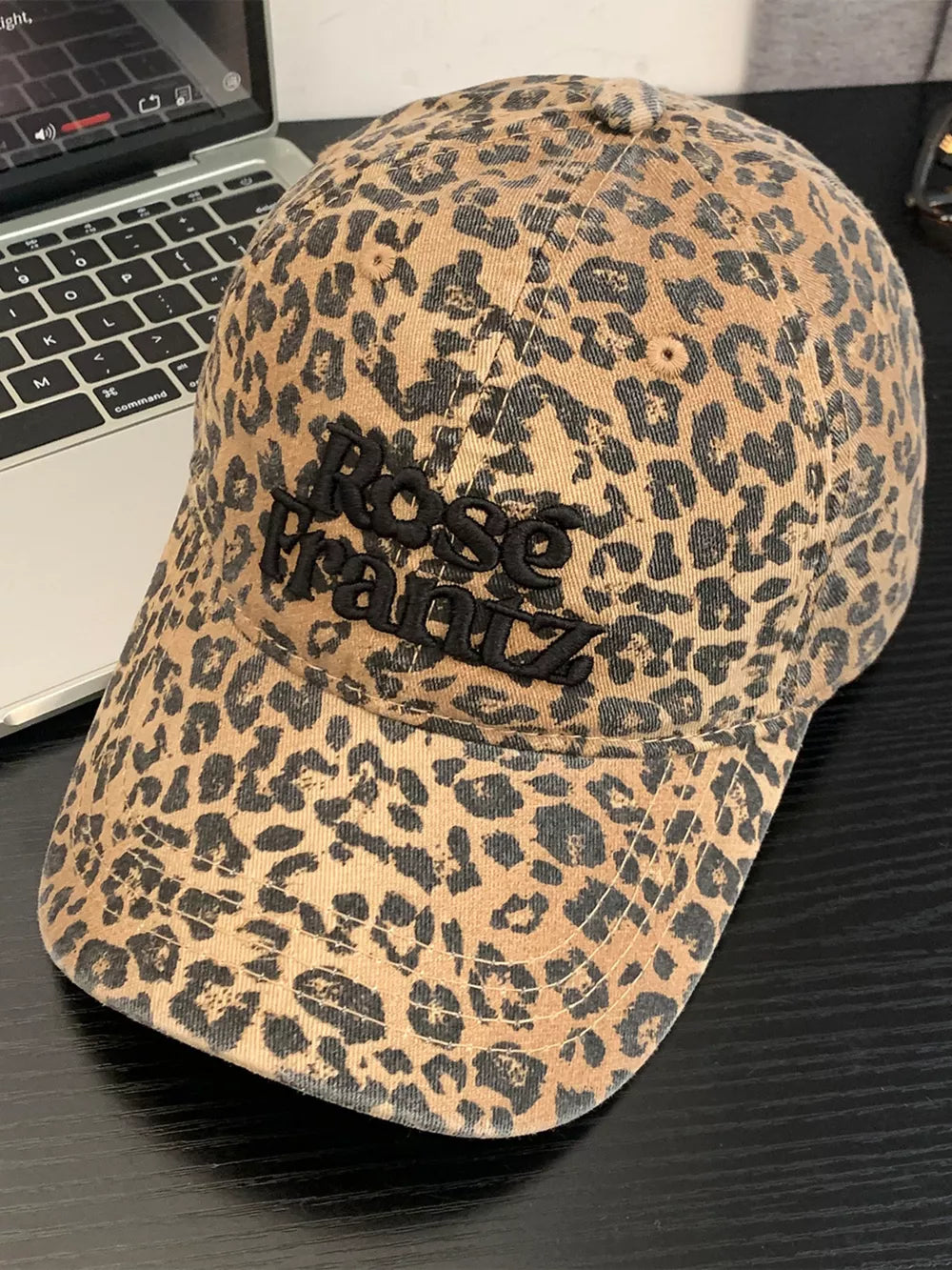 Leopard print cotton baseball cap with embroidered text