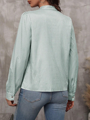 Green striped puff sleeve blouse with neck tie detail.