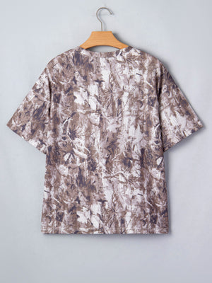 Woodland camouflage tunic with crew neck and short sleeves.