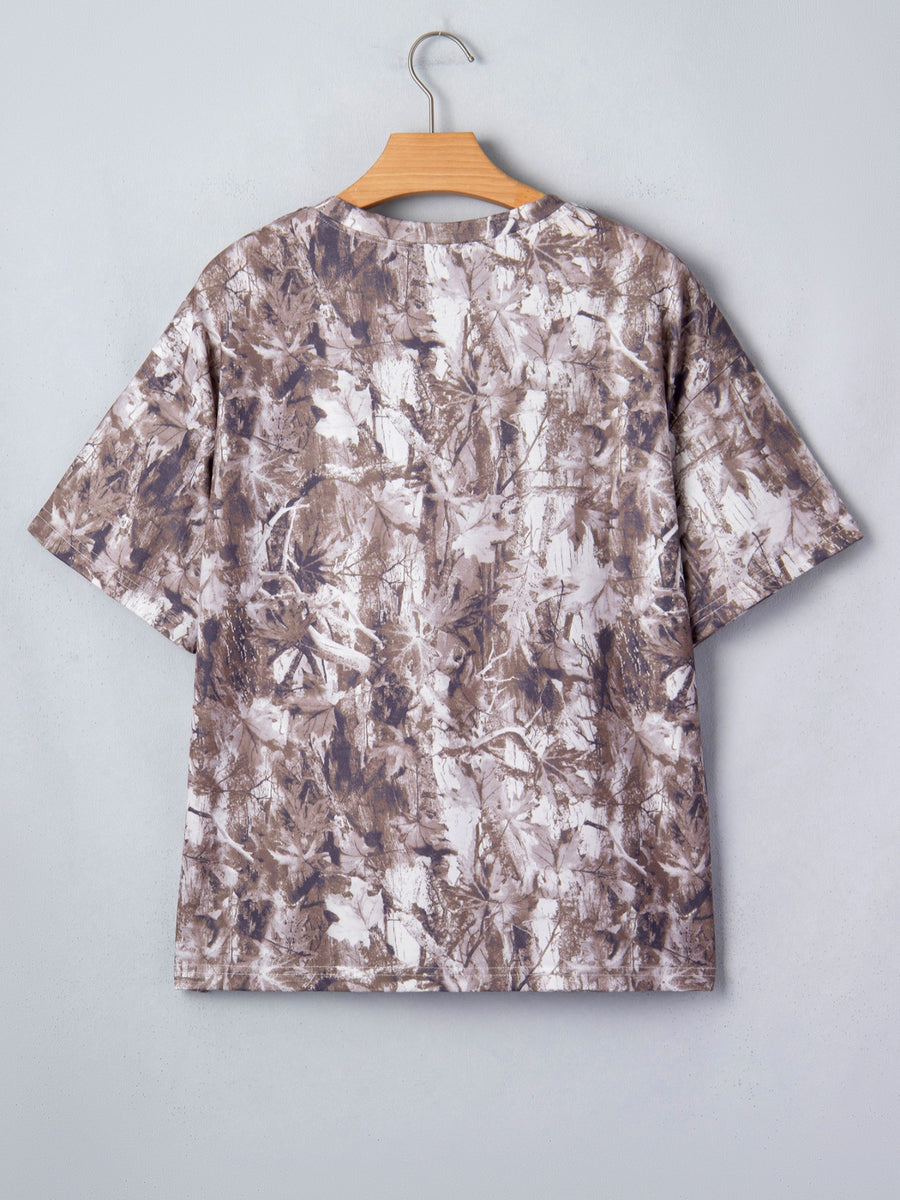 Woodland camouflage tunic with crew neck and short sleeves.