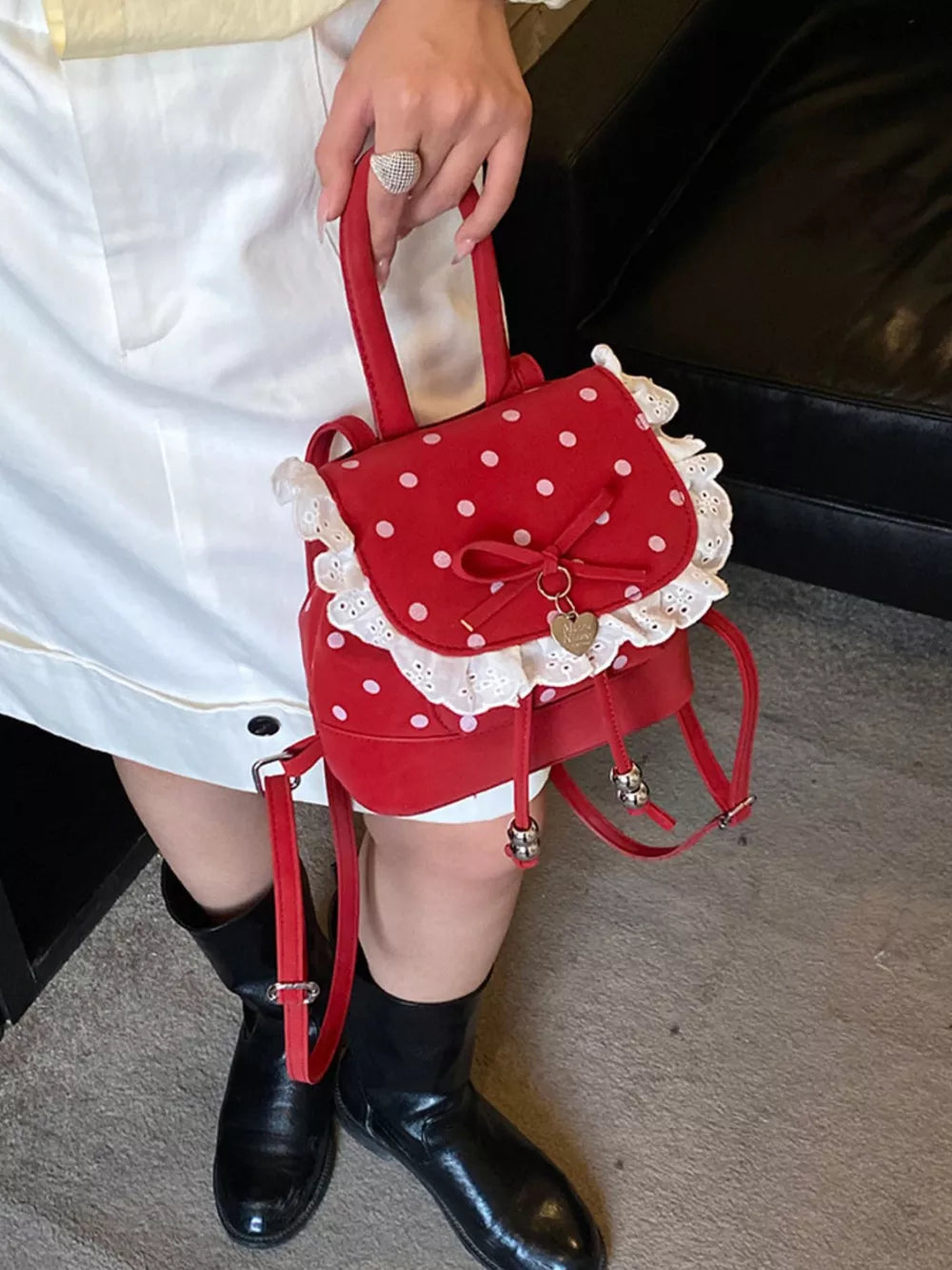 backpack in red featuring lace trim and boxy fit