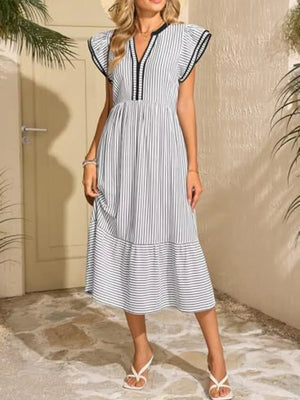 Striped midi dress with V-neck, ruffle sleeves, and tiered hem.