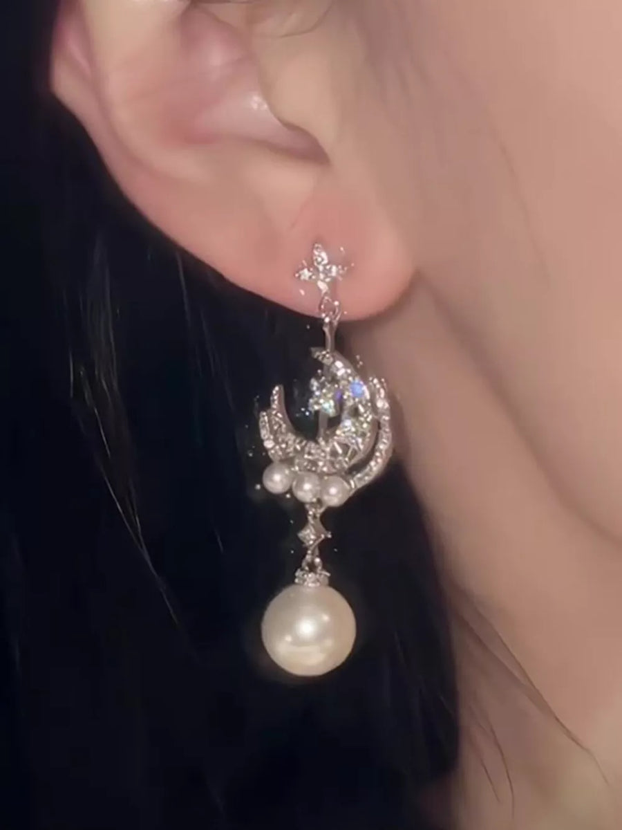 ivory earrings featuring dangle and celestial