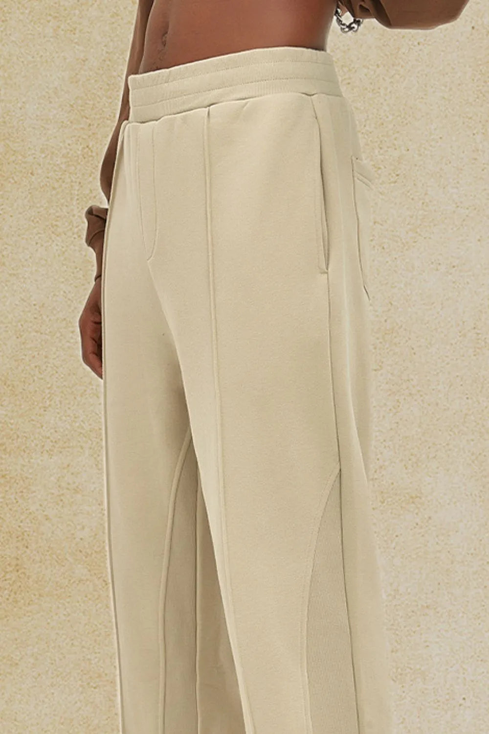 Beige seam detail lounge trousers with a relaxed fit and side pockets.