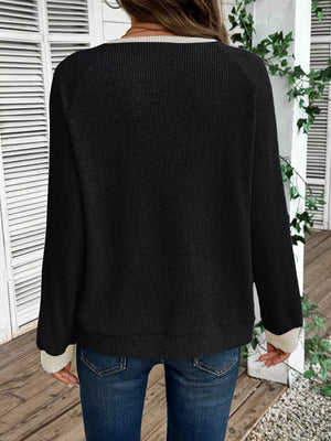 Chic ribbed two-tone maternity shirt in black with beige accents, long sleeves, and buttoned neckline.
