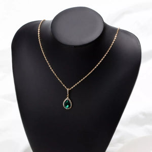 18K gold-plated necklace with a dark green teardrop crystal pendant and diamond accents.