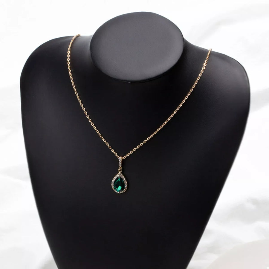 18K gold-plated necklace with a dark green teardrop crystal pendant and diamond accents.