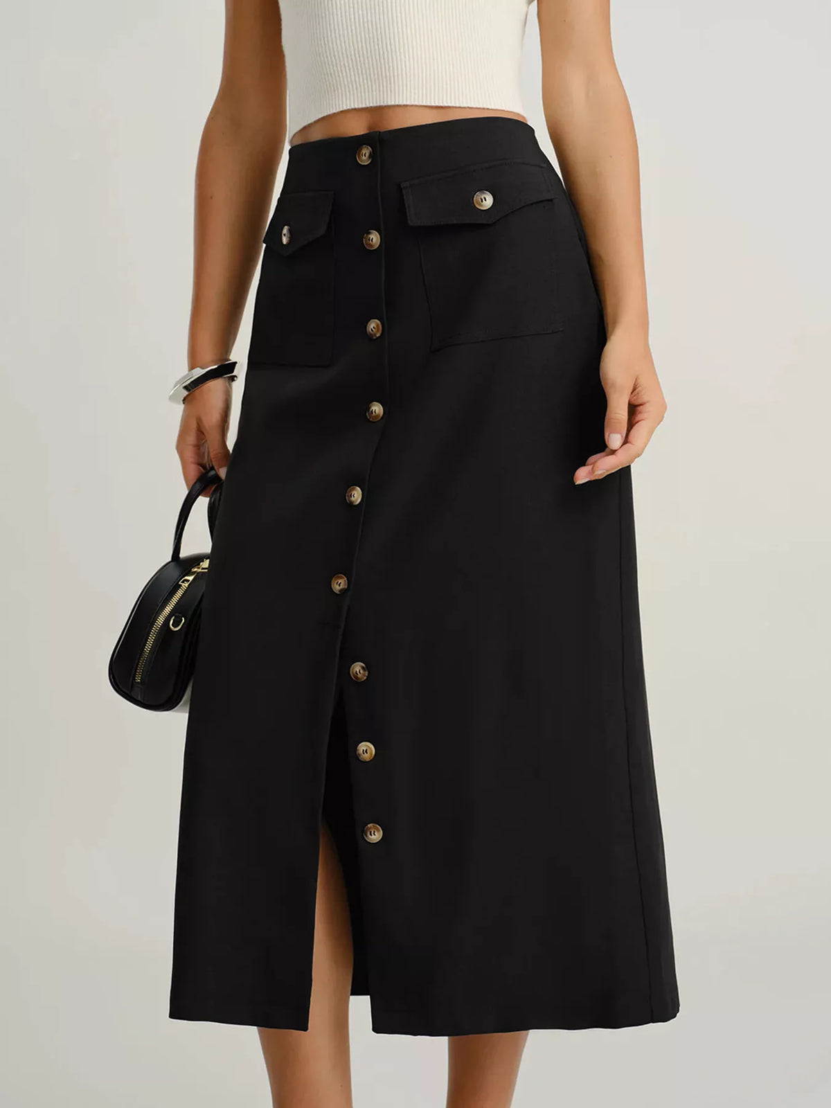 Black button-front midi skirt with pockets and a front slit.