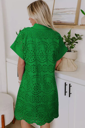 Green eyelet collared dress with short sleeves and scalloped hem.