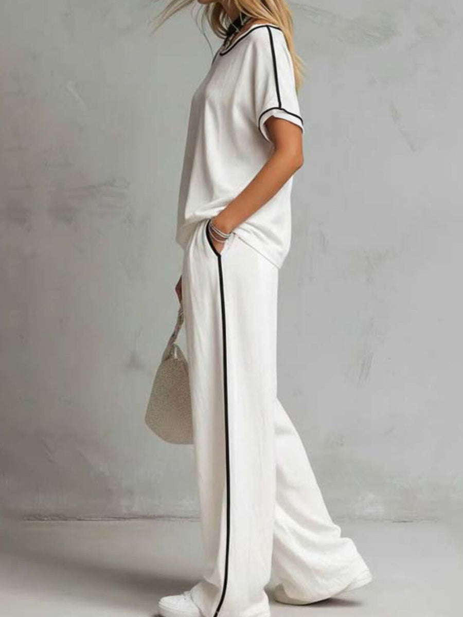 Black lounge set featuring contrast stitching and striped