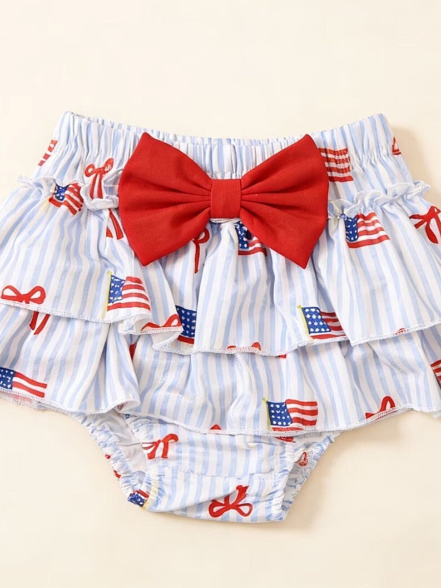Baby bloomer shorts with red bow, blue stripes, and American flag print.