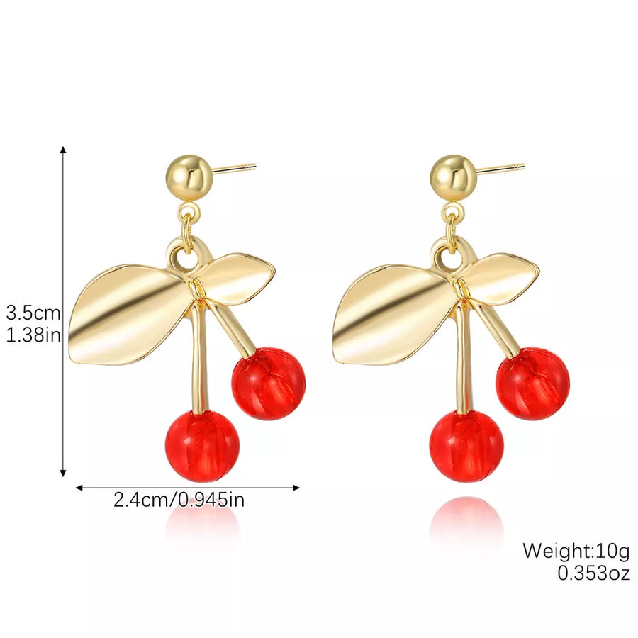 gold earrings featuring dangle design and fruit motif