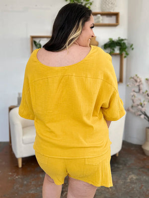 Gold textured cotton half sleeve top and drawstring shorts set with pockets.