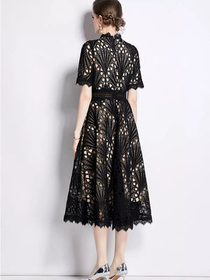 Black lace midi dress with delicate sleeves and a-line skirt.