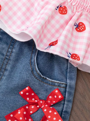 Baby girls' strawberry gingham smocked top and denim shorts with red polka dot bow.