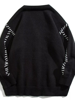 Black ribbed knit cardigan with white contrast stitching detail on sleeves and shoulders.