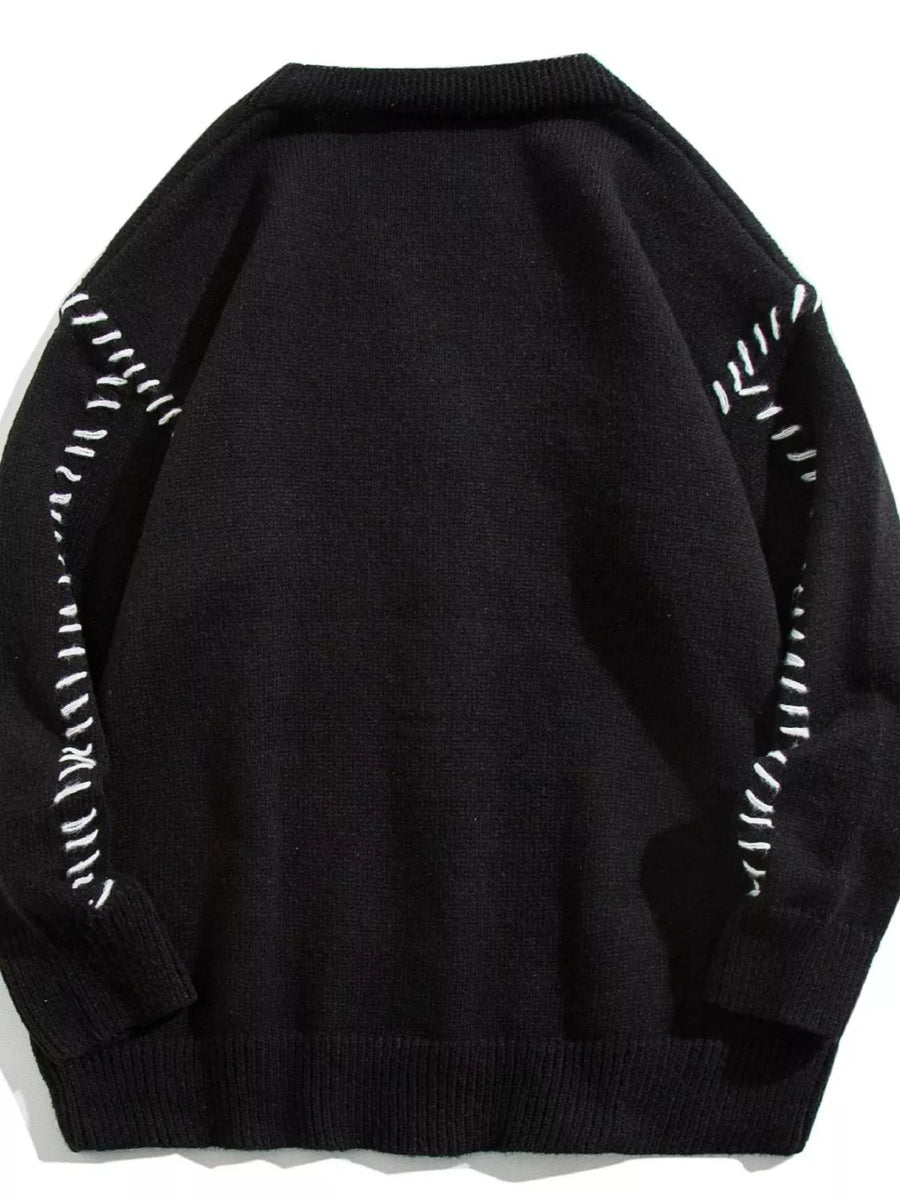 Black ribbed knit cardigan with white contrast stitching detail on sleeves and shoulders.