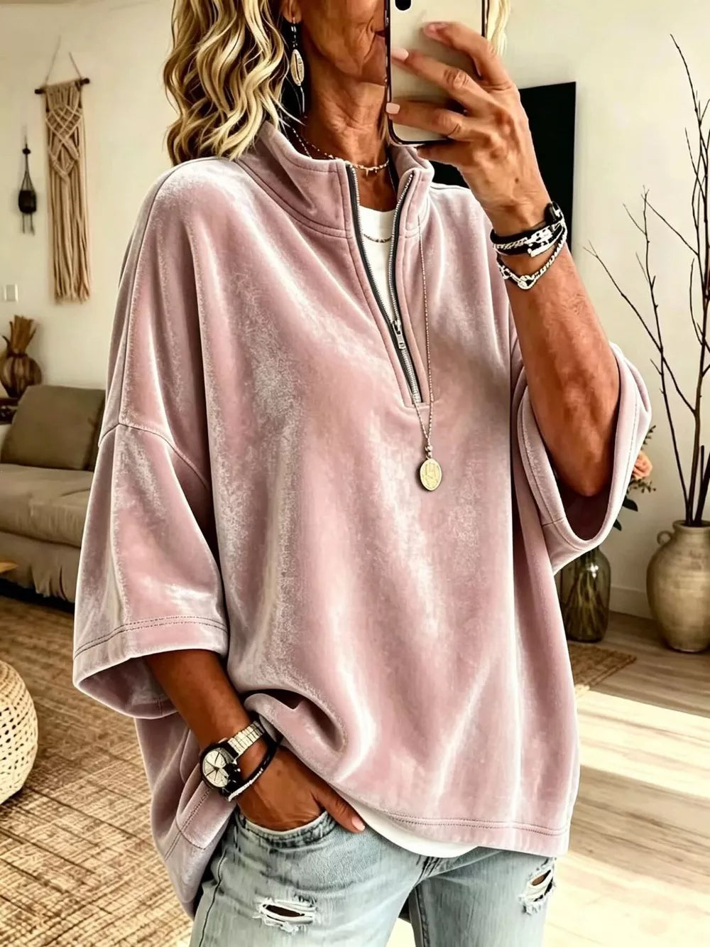 sweatshirt in blush pink featuring zipper and oversized fit